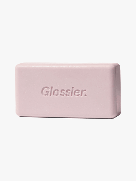 Glossier Body Hero Exfoliating Bar in branded component on a light gray background